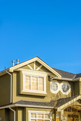 The roof of the house with nice window.