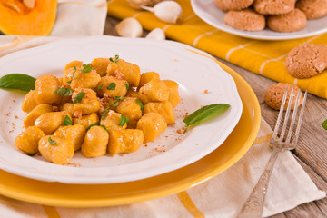 Pumpkin gnocchi with grated amaretti cookies.