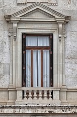 Fototapeta na wymiar Decorated window on the facade of a house