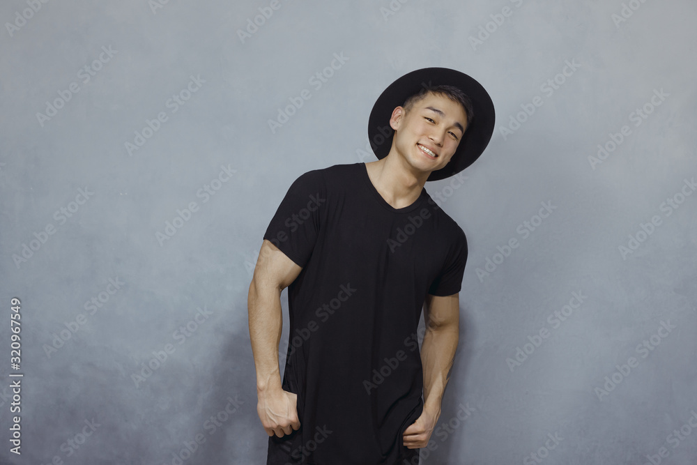 Wall mural Fashion Asian Man in Black Clothes Indoors