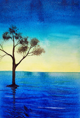 Fototapeta na wymiar Sea sunset and the lonely tree