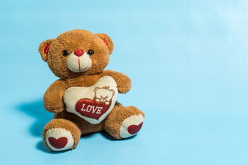 Teddy Bear toy alone with blue background