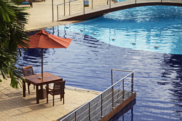 Conner of waterpool bridge with table and chairs