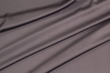 Fabric satin silk drapery. Gray textile