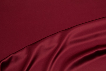 Fabric satin silk drapery. Red textile