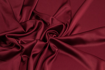 Fabric satin silk drapery. Red textile