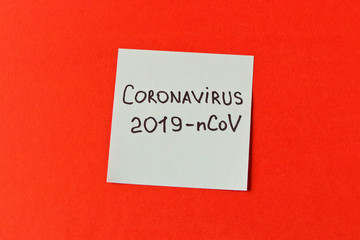 Coronavirus. Sticker with the inscription coronavirus on a red background. The concept of protection from the virus. Selective focus.