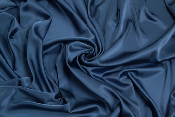Fabric satin silk drapery. Blue textile