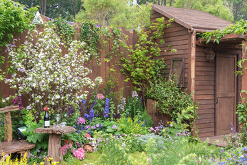 Fototapeta na wymiar Backyard flower garden of old residential house