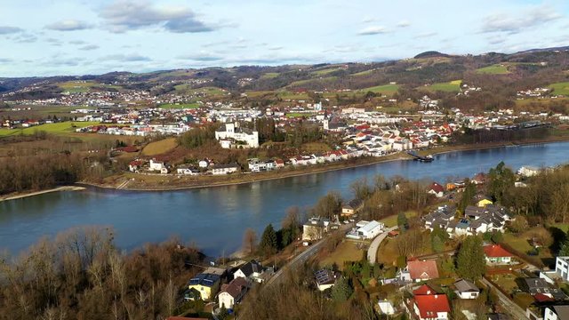 Aerial footage of two small places on river Danube in Upper Austria on sunny day in February