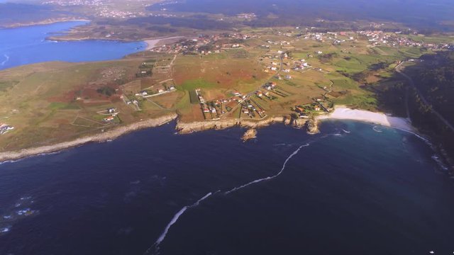 Beautiful drone aerial panorama of Playa Barizo coastline, Spain. Panning camera shot.