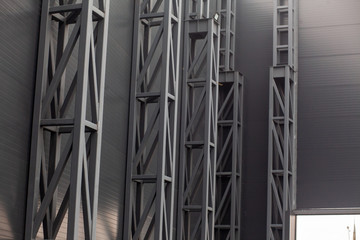 metal structures on the wall of a shopping center