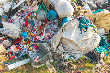 dump garbage background waste trash plastic and clothes global pollution ecological disaster...