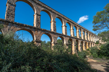 Fototapeta premium Ancient roman aqueduct Ponte del Diable or Devil's Bridge in Tarragona, Spain.