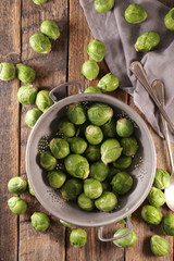 raw brussels sprouts on wood background