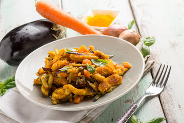 chicken stewed with eggpalnts carrots basil and turmeric spice