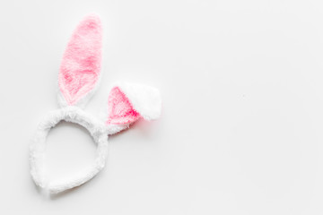 Easter bunny concept. Toy rabbit's ears for head on white background top-down copy space