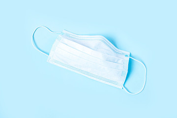 Medical protective mask isolated on blue background