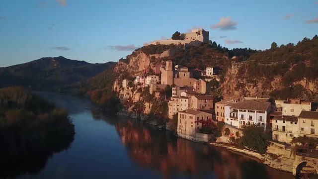 Aerial miravet sunset castle over village river