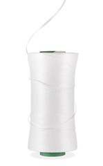 White technical cord wound on a coil with a curly thread in a vertical position is isolated on a white background. Side view.