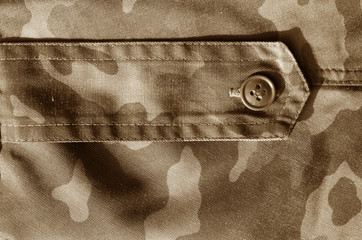 Part of military camo uniform in brown tone.