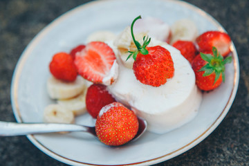 ice cream dessert with fruit close-up. Advertising concept of desserts, sweets, cooking, holidays