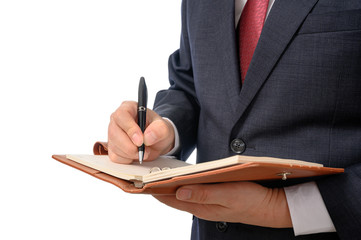 Businessman with a notebook in his hand and a pen to write something