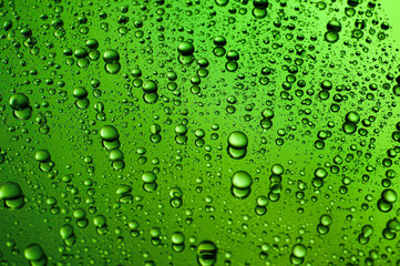 Drops of water on color background