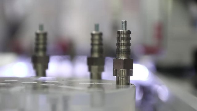 robotic arm pick and place metal work piece in production line