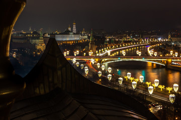 The photo was taken from the roof of the Church of Christ the Savior. You can see its Golden columns, illuminated Kremlin embankment, Armory and others landmarks in the heart of the Russian capital.