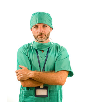 Isolated Portrait Of Attractive And Handsome Medicine Doctor Or Hospital Nurse Man In Surgical Bouffant Hat And Medical Scrub Looking Serious And Intense In Health Care Concept