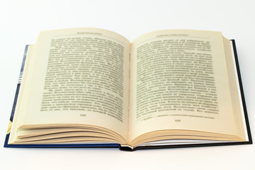 Open book with blurred text on white background
