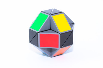 Toy colorful snake puzzle in shape of ball on white background