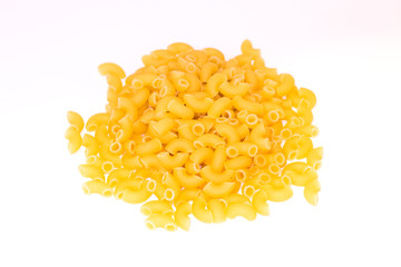 A pile of pasta horns on white background