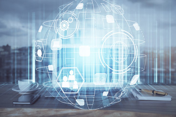 Computer on desktop with social network hologram. Multi exposure. Concept of international people connections.
