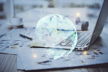 Computer on desktop with social network theme icon. Multi exposure. Concept of international...