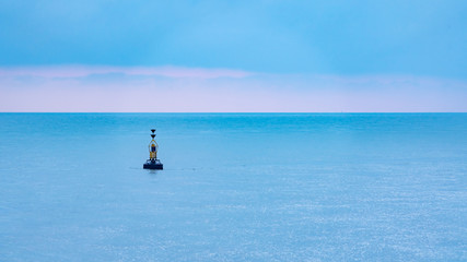 Fototapeta premium Small marker bouy sitting in the English channel