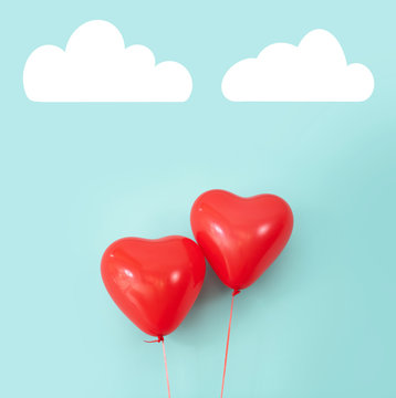 Two Heart Shaped Red Air Baloon Front Of A Font. Valentined Day And Romance Concept.