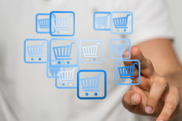 Businessman pressing modern technology panel shopping cart web phone credit card.