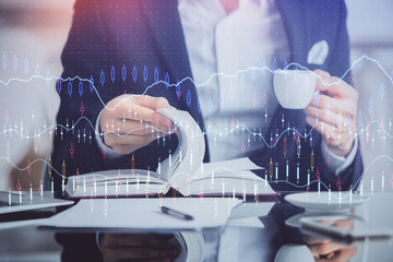 Double exposure of businessman with coffee with stock market forex chart.