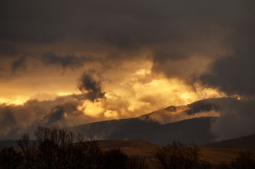 Fototapeta na wymiar Low clouds covering the surrounding peaks in Retezat Mountains National Park - Hunedoara