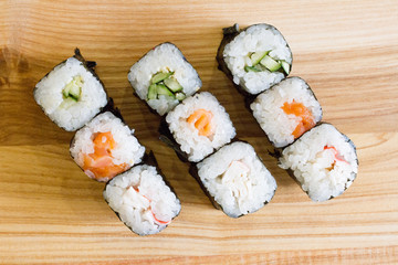 Fresh and delicious rolls, sushi and Japanese cuisine. rolls with salmon, avocado, cucumber, flying fish ROE and cream cheese inside. Sushi menu. Flatley food. the view from the top.