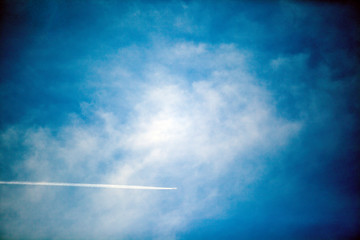 plane in the sky against the blue sky