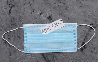 Syringe, vaccine, protective mask and paper with an inscription Coronavirus.
