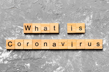 what is coronavirus word written on wood block. what is coronavirus text on wooden table for your...