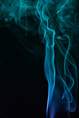 Blue smoke on black background