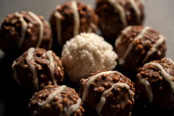 Close up of chocolate balls with nuts.