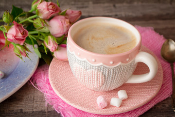 Valentine's Day Coffee with heart on knitted cup. cappuccino or latte art coffee. Love concept