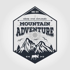 Mountain Adventure vintage label, badge, logo or emblem. Vector illustration.