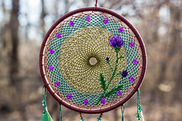 Naklejka premium Handmade dream catcher with feathers threads and beads rope hanging